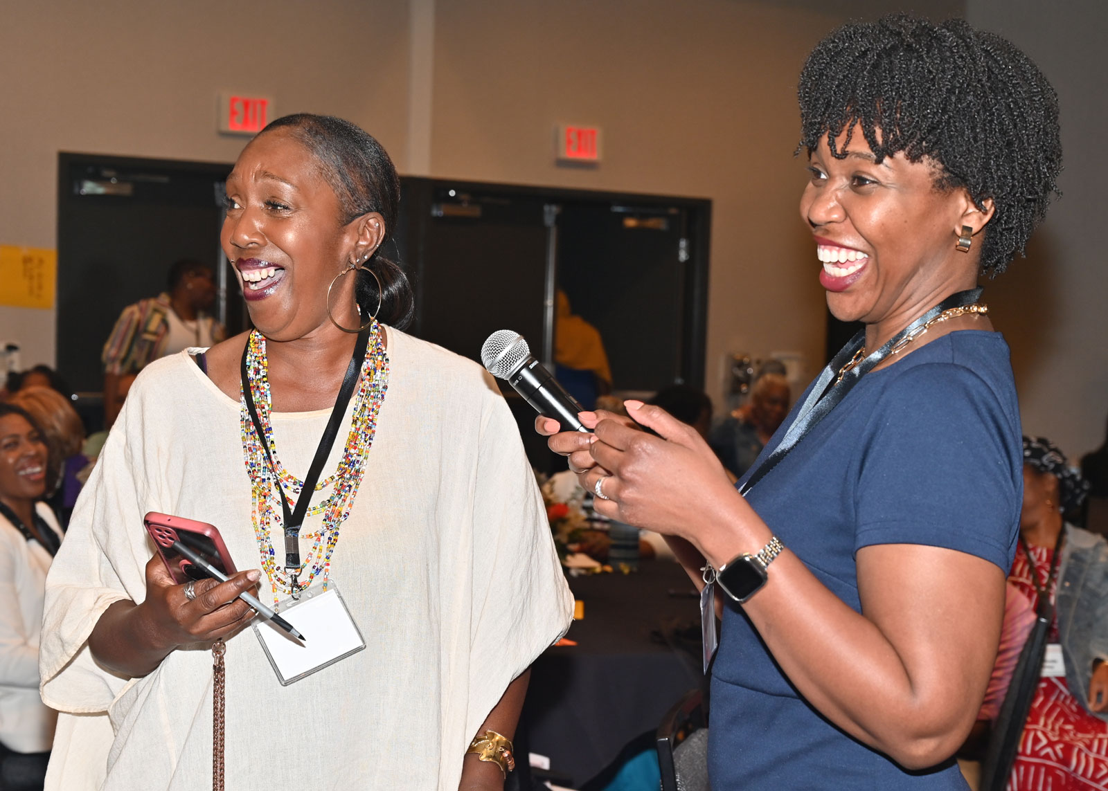 Crystal Pirtle Tyler engaging in conversation with an attendee at the Black Women's Health Forum, one of the many ways Jeweld Consulting is addressing health disparities in Alameda County.